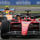 A photo of Charles Leclerc racing Lando Norris in Italy.